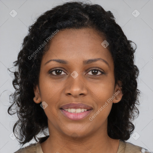 Joyful black young-adult female with long  brown hair and brown eyes