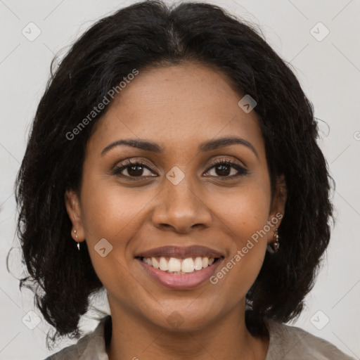 Joyful black young-adult female with medium  brown hair and brown eyes