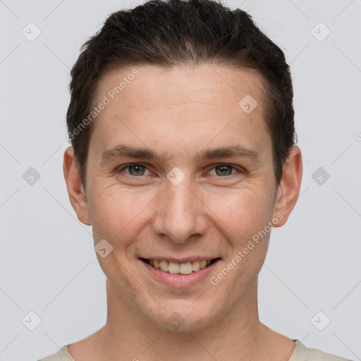 Joyful white adult male with short  brown hair and brown eyes