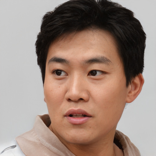 Neutral asian young-adult male with short  black hair and brown eyes