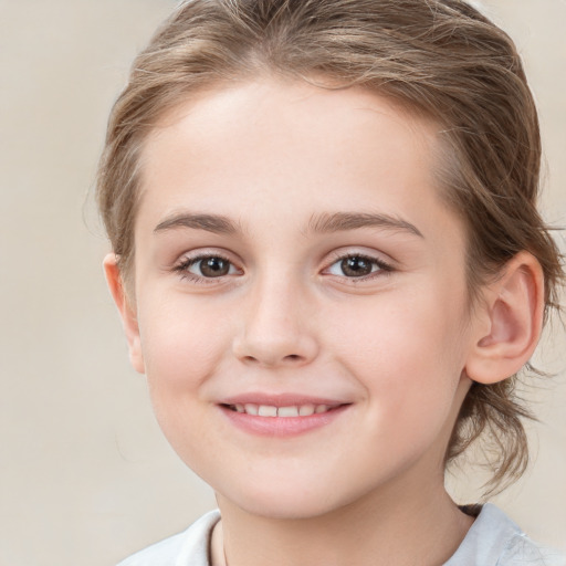 Joyful white child female with medium  brown hair and brown eyes