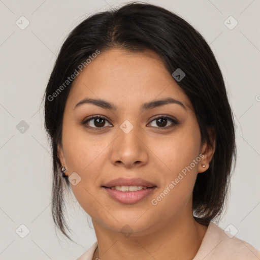 Joyful latino young-adult female with medium  brown hair and brown eyes