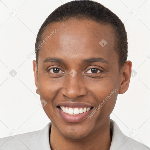 Joyful black young-adult male with short  brown hair and brown eyes