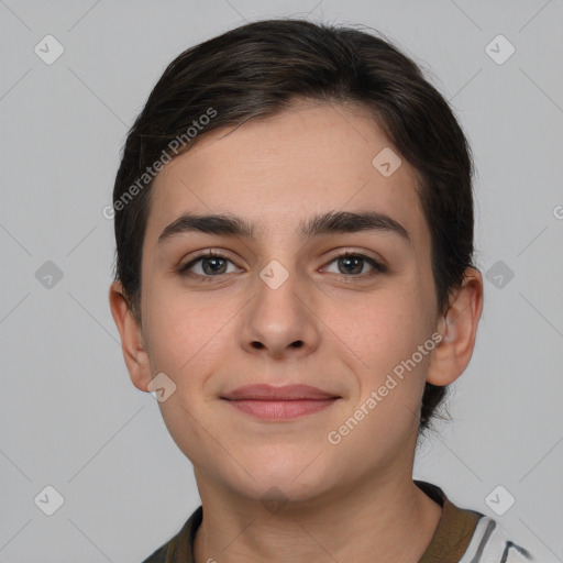 Joyful white young-adult female with short  brown hair and brown eyes