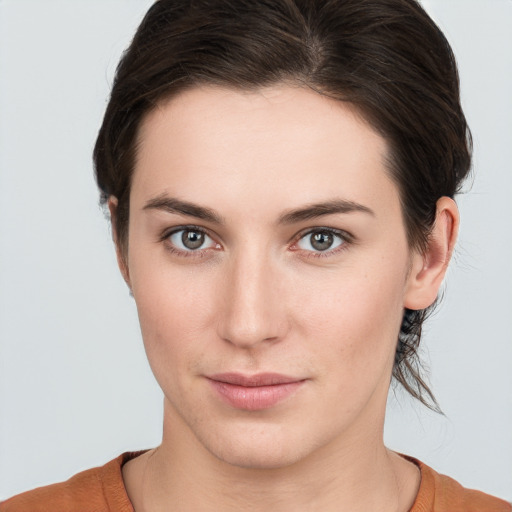 Neutral white young-adult female with short  brown hair and brown eyes