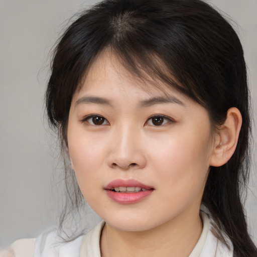 Joyful asian young-adult female with medium  brown hair and brown eyes