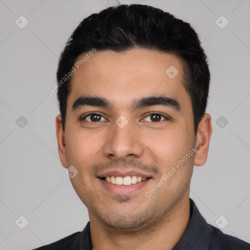 Joyful white young-adult male with short  black hair and brown eyes