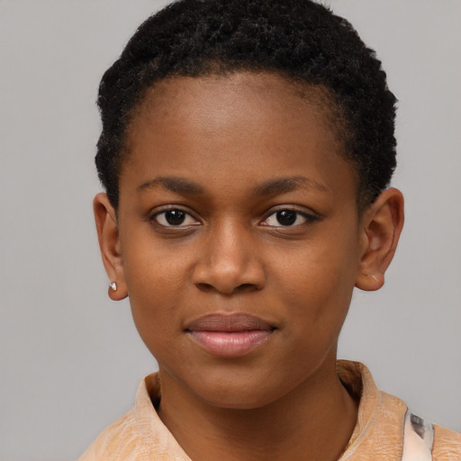 Joyful black child female with short  brown hair and brown eyes