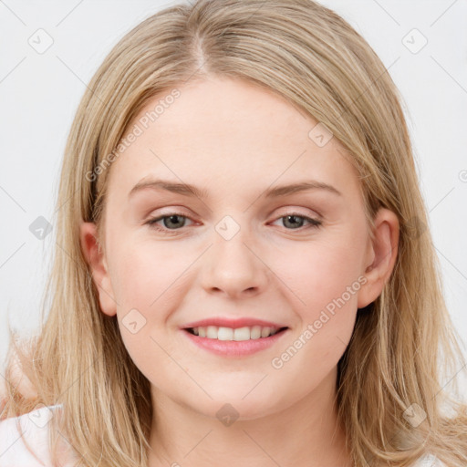 Joyful white young-adult female with long  brown hair and blue eyes