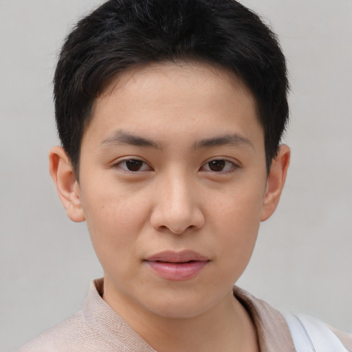 Joyful asian young-adult female with short  brown hair and brown eyes