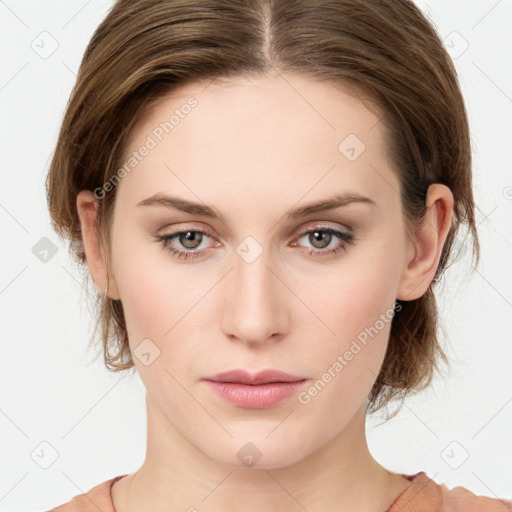 Neutral white young-adult female with medium  brown hair and green eyes