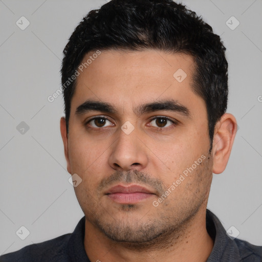 Neutral latino young-adult male with short  black hair and brown eyes