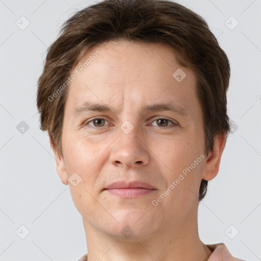 Joyful white adult male with short  brown hair and grey eyes