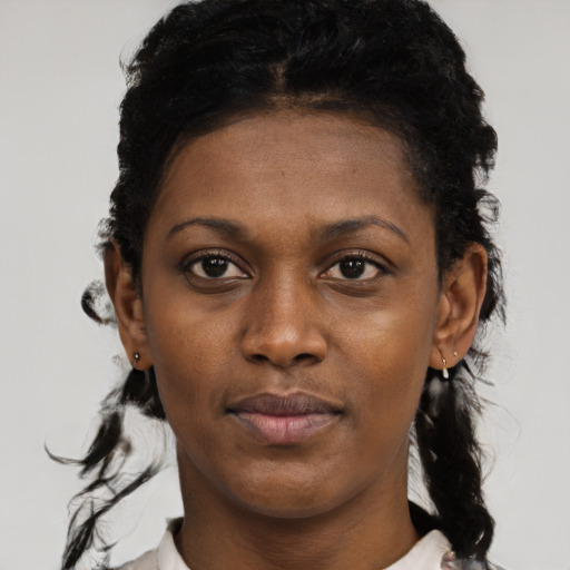 Neutral black young-adult female with short  black hair and brown eyes