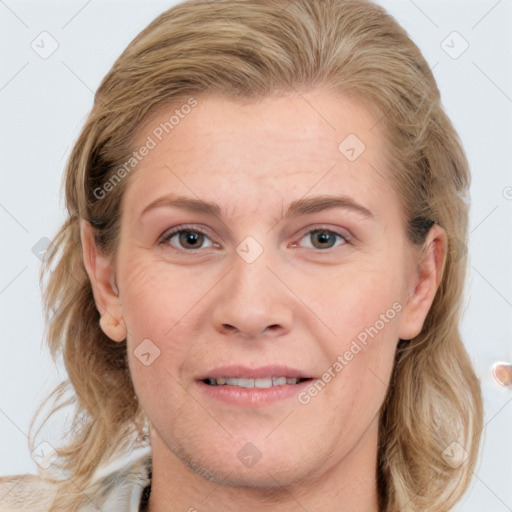 Joyful white adult female with medium  brown hair and grey eyes