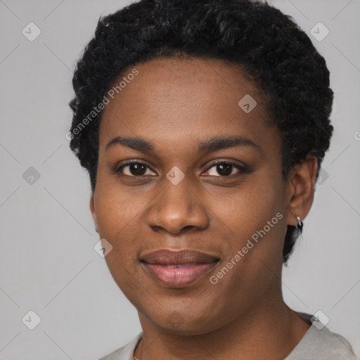 Joyful black young-adult female with short  black hair and brown eyes