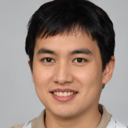 Joyful asian young-adult male with short  brown hair and brown eyes