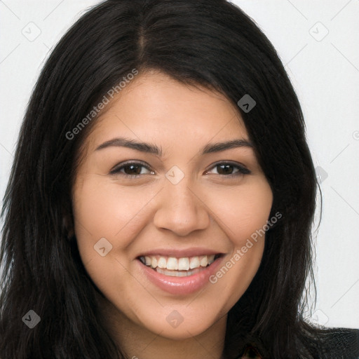 Joyful latino young-adult female with long  brown hair and brown eyes