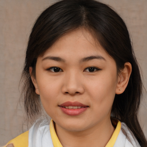 Joyful asian young-adult female with medium  brown hair and brown eyes