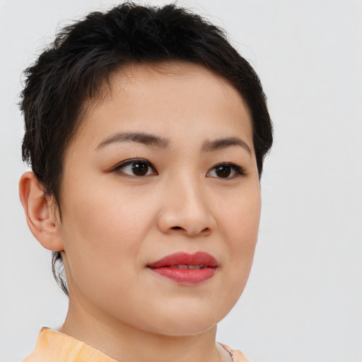 Joyful asian young-adult female with short  brown hair and brown eyes
