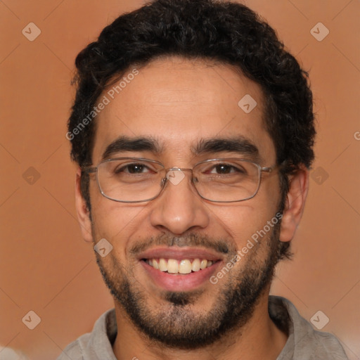 Joyful latino young-adult male with short  brown hair and brown eyes