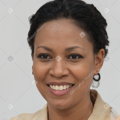 Joyful latino adult female with short  brown hair and brown eyes