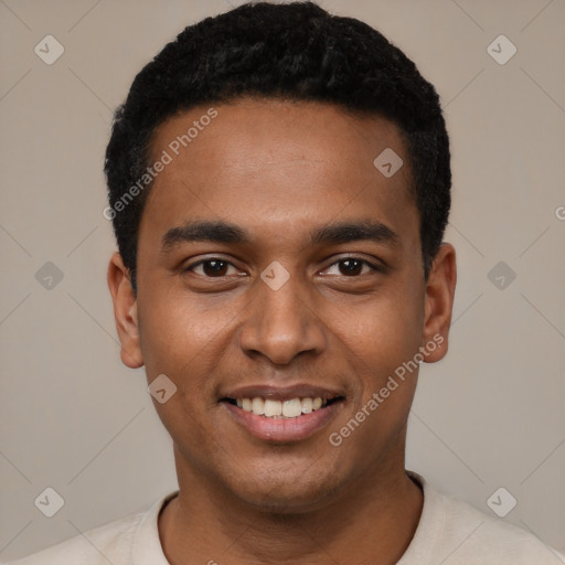 Joyful black young-adult male with short  black hair and brown eyes