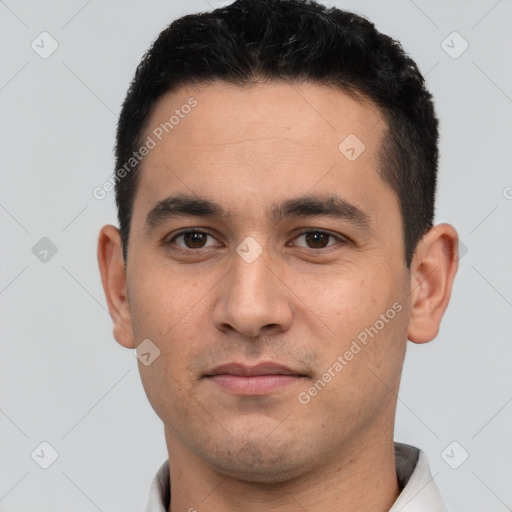 Joyful white young-adult male with short  black hair and brown eyes