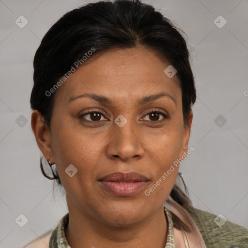 Joyful latino adult female with medium  brown hair and brown eyes
