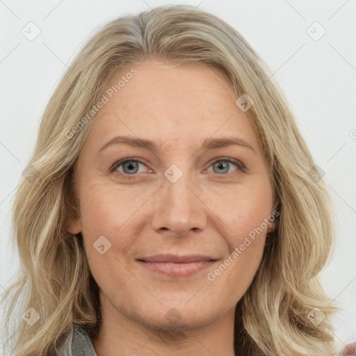 Joyful white adult female with long  brown hair and grey eyes