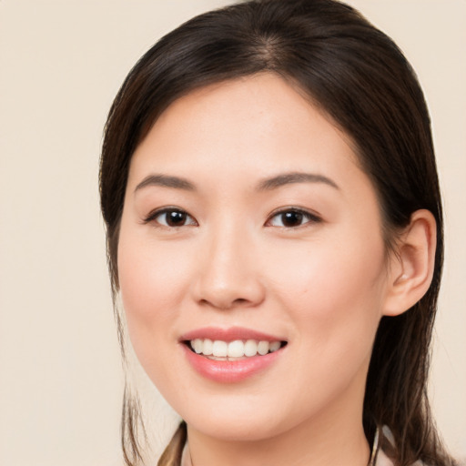 Joyful white young-adult female with medium  brown hair and brown eyes