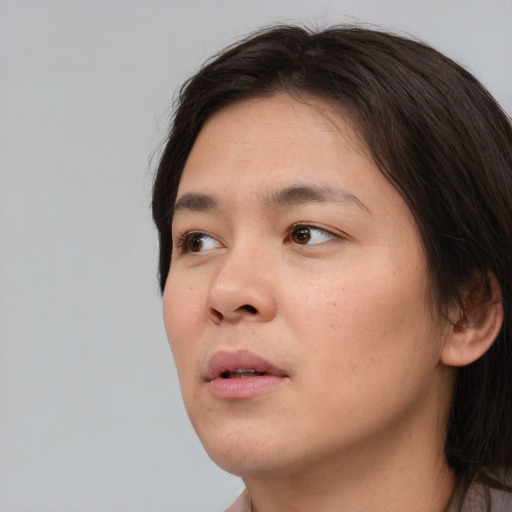 Neutral asian young-adult female with short  brown hair and brown eyes