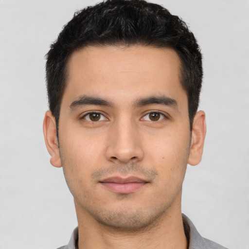 Neutral latino young-adult male with short  black hair and brown eyes