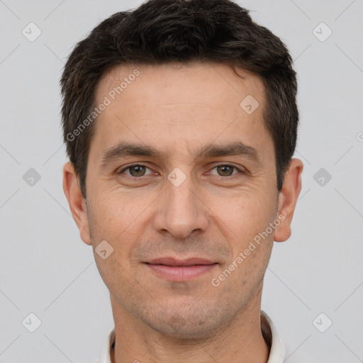 Joyful white adult male with short  brown hair and brown eyes