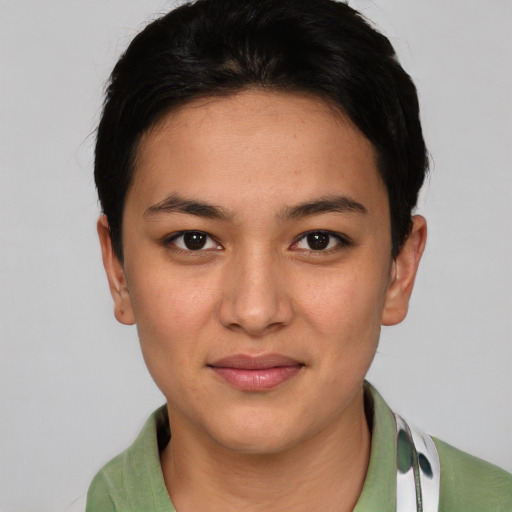 Joyful asian young-adult female with short  black hair and brown eyes