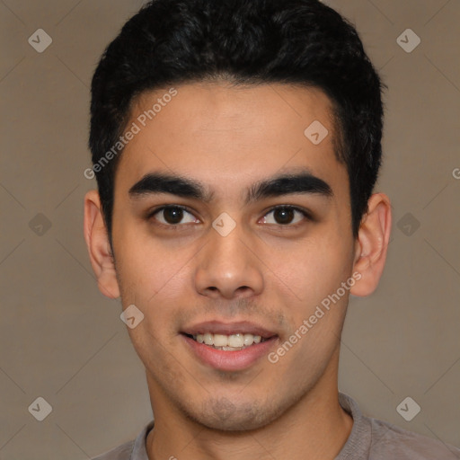 Joyful latino young-adult male with short  black hair and brown eyes