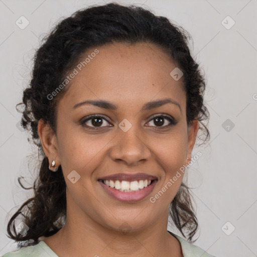 Joyful black young-adult female with medium  brown hair and brown eyes