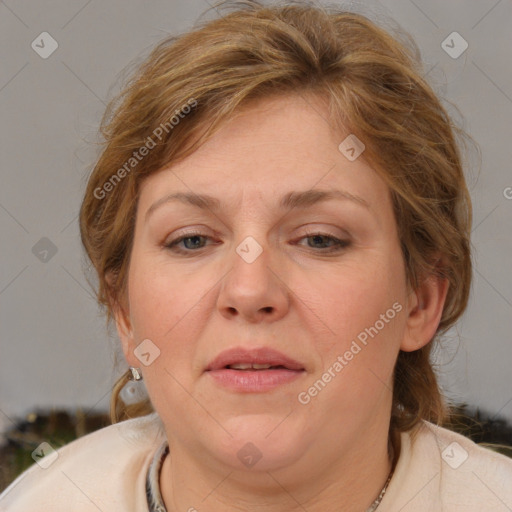 Joyful white adult female with medium  brown hair and blue eyes