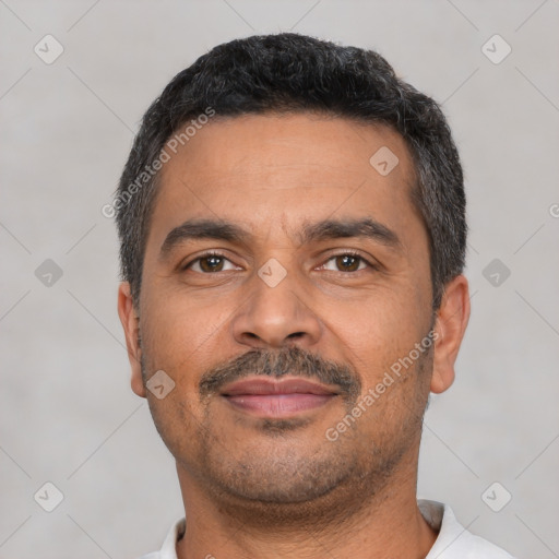 Neutral latino adult male with short  black hair and brown eyes