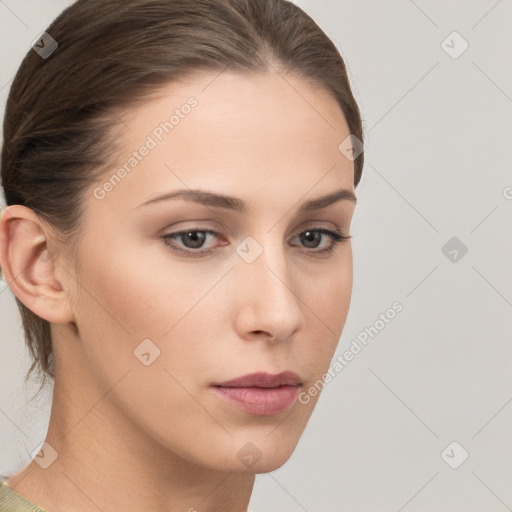 Neutral white young-adult female with long  brown hair and brown eyes