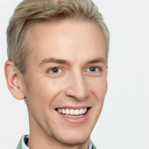 Joyful white adult male with short  brown hair and grey eyes