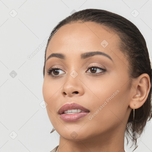 Joyful latino young-adult female with long  black hair and brown eyes