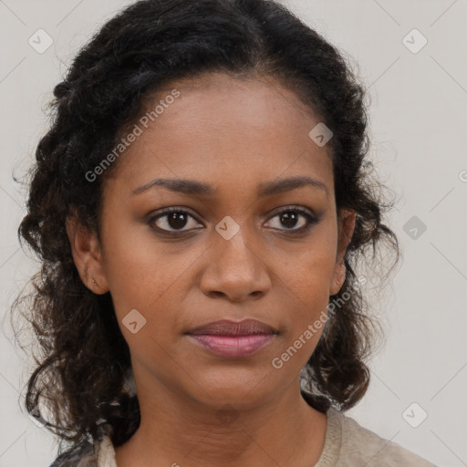 Joyful black young-adult female with long  brown hair and brown eyes