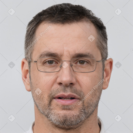 Joyful white adult male with short  brown hair and brown eyes