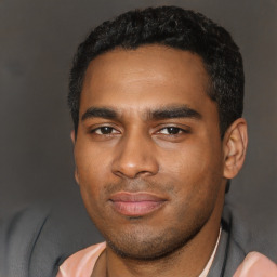 Joyful latino young-adult male with short  black hair and brown eyes