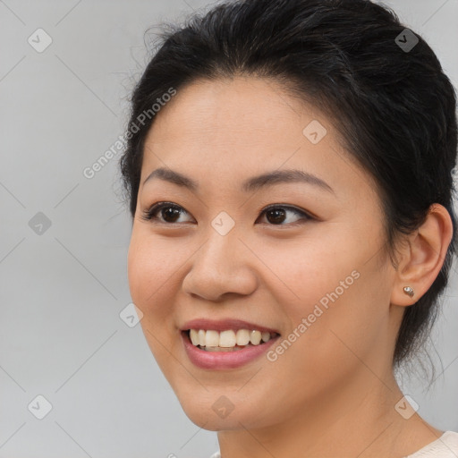 Joyful asian young-adult female with medium  brown hair and brown eyes