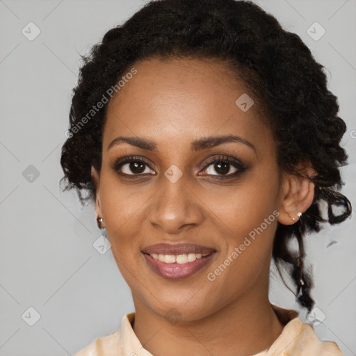 Joyful black young-adult female with medium  brown hair and brown eyes