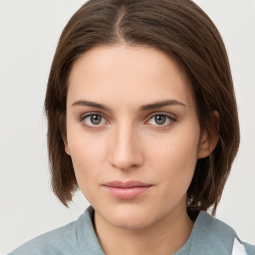 Neutral white young-adult female with medium  brown hair and grey eyes