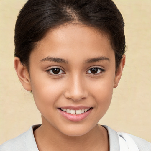 Joyful white child female with short  brown hair and brown eyes