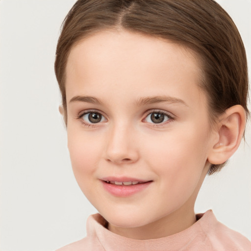 Joyful white child female with short  brown hair and brown eyes